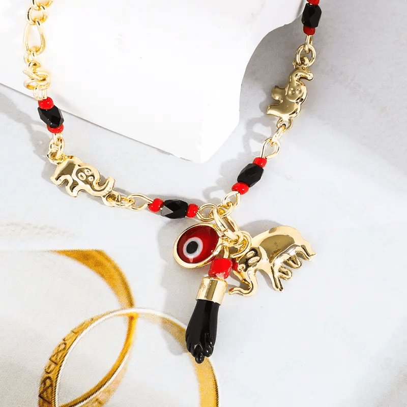 Valeria Montes Conjunto de Pulsera con Elefante y Ojo Turco de 14K